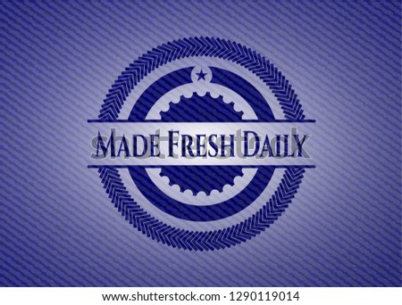 Made Fresh Daily emblem with jean background