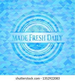 Made Fresh Daily light blue emblem with triangle mosaic background