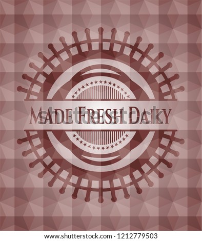 Made Fresh Daily red seamless emblem with geometric background.