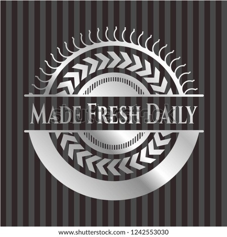 Made Fresh Daily silver emblem or badge
