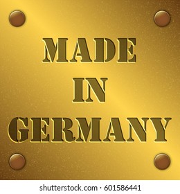 made in Germany text on gold metal plate with bolts in corners, Golden texture
