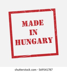 made in Hungary text rubber seal stamp watermark. Caption inside rounded rectangular banner with grunge design and dirty texture. Slanted vector ink sticker on paper background.
