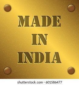 made in India text on gold metal plate with bolts in corners, Golden texture