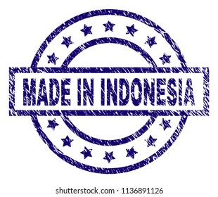 MADE IN INDONESIA stamp seal watermark with distress texture. Designed with rectangle, circles and stars. Blue vector rubber print of MADE IN INDONESIA text with grunge texture.