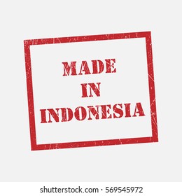 made in Indonesia text rubber seal stamp watermark. Caption inside rounded rectangular banner with grunge design and dirty texture. Slanted vector ink sticker on paper background.