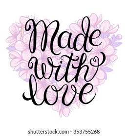 Made with love - hand lettering calligraphic inscription on the floral background of cherry blossom in heart shape
