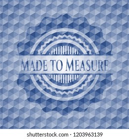 Made to Measure blue emblem or badge with geometric pattern background.