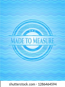Made to Measure light blue water emblem background.