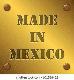 made in Mexico text on gold metal plate with bolts in corners, Golden texture
