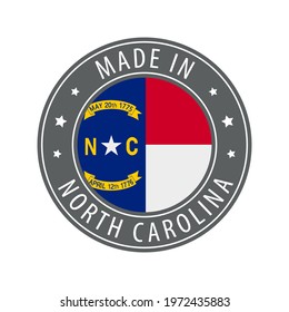 Made in North Carolina icon. Gray stamp with a round state flag.