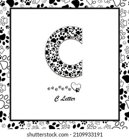 Made of paw print C letter. Black and white paw prints seamless fabric textile design pattern frame