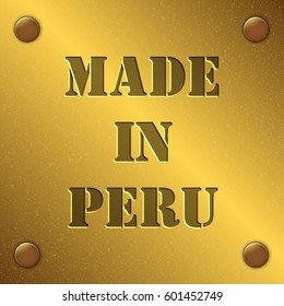 made in Peru text on gold metal plate with bolts in corners, Golden texture