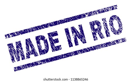 MADE IN RIO stamp seal watermark with distress style. Blue vector rubber print of MADE IN RIO tag with dust texture. Text tag is placed between parallel lines.