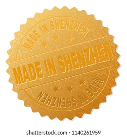 MADE IN SHENZHEN gold stamp award. Vector gold award of MADE IN SHENZHEN text. Text labels are placed between parallel lines and on circle. Golden skin has metallic texture.
