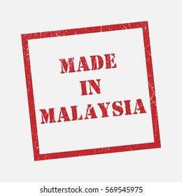 made in text Malaysia rubber seal stamp watermark. Caption inside rounded rectangular banner with grunge design and dirty texture. Slanted vector ink sticker on paper background.