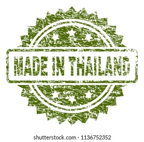 MADE IN THAILAND stamp seal watermark with rubber print style. Green vector rubber print of MADE IN THAILAND text with grunge texture.