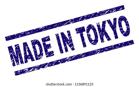MADE IN TOKYO stamp seal watermark with grunge style. Blue vector rubber print of MADE IN TOKYO tag with grunge texture. Text tag is placed between parallel lines.