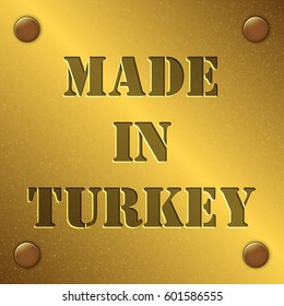 made in Turkey text on gold metal plate with bolts in corners, Golden texture