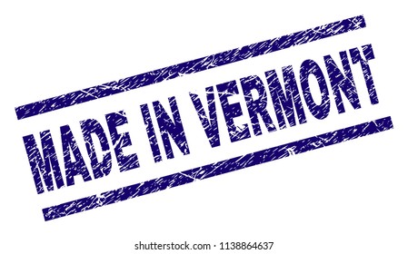 MADE IN VERMONT stamp seal watermark with grunge style. Blue vector rubber print of MADE IN VERMONT title with dirty texture. Text label is placed between parallel lines.