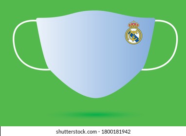 Madrid/Spain - August 21, 2020: Surgical Face Mask With Real Madrid Logo In Covid-19,Corona Virus Pandemic Isolated On Green Background.