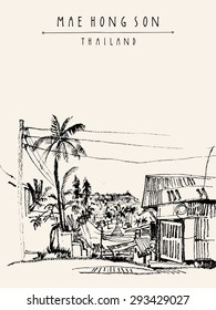 Mae Hong Son, Thailand, Southeast Asia. City center. Traditional Northern Thai wooden house, palm trees, electric wires. Monochrome vertical postcard banner poster template. Copy space, hand lettering