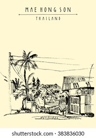 Maehongson, Thailand, Southeast Asia. City center. Traditional Northern Thai wooden house, palm trees, electric wires. Artistic postcard banner poster template with hand lettering