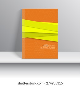 Magazine Cover with overlapping shapes and triangles.