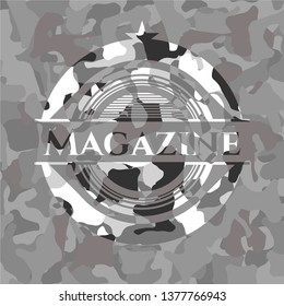 Magazine written on a grey camouflage texture