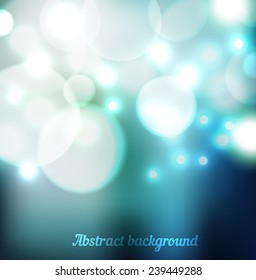 Magic  blurred blue background with bokeh lights snowfall. Perfect template for posters, websites, magazines, brochures, catalogs