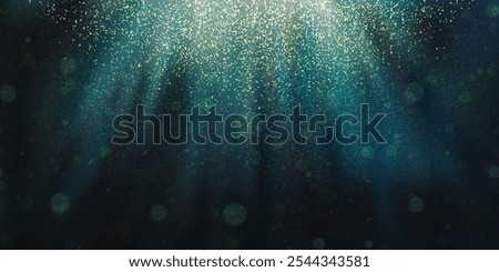 Magic christmas rays of light or underwater with glowing plankton, overlay effects and bokeh. Dark blue gradient background and photo fluorescent particles and microorganisms