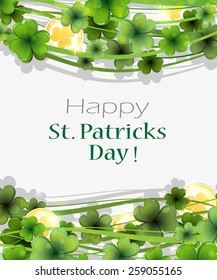 Magic clover and gold coins on a white background.  St. Patrick's Day abstract background
