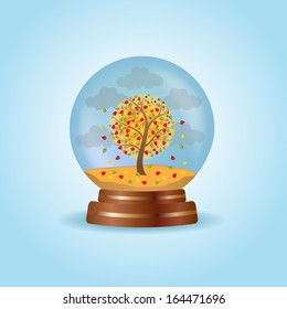 Magic crystal globe with autumnal tree