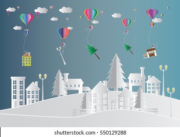 magic of  delivery service with  hot air balloon and winter season , Snow Urban Countryside Landscape City Village ,paper art and craft style.