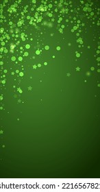 Magic falling snow christmas background. Subtle flying snow flakes and stars on christmas green background. Magic falling snow holiday scenery.   Vertical vector illustration.