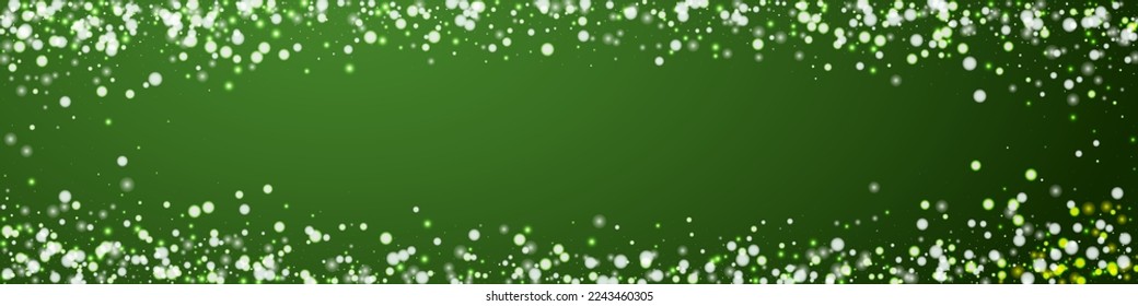 Magic falling snow christmas background. Subtle flying snow flakes and stars on christmas green background. Magic falling snow holiday scenery.   Panoramic vector illustration.