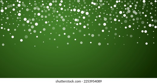 Magic falling snow christmas background. Subtle flying snow flakes and stars on christmas green background. Magic falling snow holiday scenery.   Wide vector illustration.