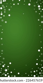 Magic falling snow christmas background. Subtle flying snow flakes and stars on christmas green background. Magic falling snow holiday scenery.   Vertical vector illustration.