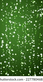 Magic falling snow christmas background. Subtle flying snow flakes and stars on christmas green background. Magic falling snow holiday scenery.   Vertical vector illustration.