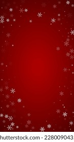 Magic falling snow christmas background. Subtle flying snow flakes and stars on christmas red background. Magic falling snow holiday scenery.   Vertical vector illustration.