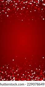 Magic falling snow christmas background. Subtle flying snow flakes and stars on christmas red background. Magic falling snow holiday scenery.   Vertical vector illustration.