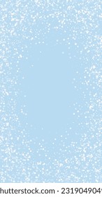 Magic falling snow christmas background. Subtle flying snow flakes and stars on light blue winter backdrop. Magic falling snow holiday scenery.   Vertical vector illustration.