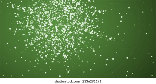 Magic falling snow christmas background. Subtle flying snow flakes and stars on christmas green background. Magic falling snow holiday scenery.   Wide vector illustration.
