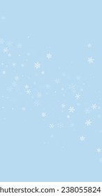 Magic falling snow christmas background. Subtle flying snow flakes and stars on light blue winter backdrop. Magic falling snow holiday scenery.   Vertical vector illustration.