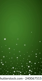 Magic falling snow christmas background. Subtle flying snow flakes and stars on christmas green background. Magic falling snow holiday scenery.   Vertical vector illustration.