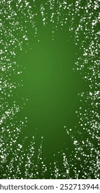 Magic falling snow christmas background. Subtle flying snow flakes and stars on christmas green background. Magic falling snow holiday scenery.   Vertical vector illustration.