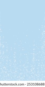 Magic falling snow christmas background. Subtle flying snow flakes and stars on light blue winter backdrop. Magic falling snow holiday scenery.   Vertical vector illustration.