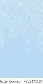 Magic falling snow christmas background. Subtle flying snow flakes and stars on light blue winter backdrop. Magic falling snow holiday scenery.   Vertical vector illustration.