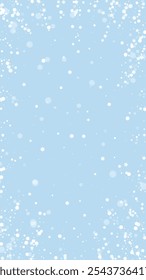 Magic falling snow christmas background. Subtle flying snow flakes and stars on light blue winter backdrop. Magic falling snow holiday scenery.   Vertical vector illustration.