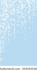 Magic falling snow christmas background. Subtle flying snow flakes and stars on light blue winter backdrop. Magic falling snow holiday scenery. Vertical vector illustration.