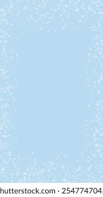 Magic falling snow christmas background. Subtle flying snow flakes and stars on light blue winter backdrop. Magic falling snow holiday scenery.   Vertical vector illustration.